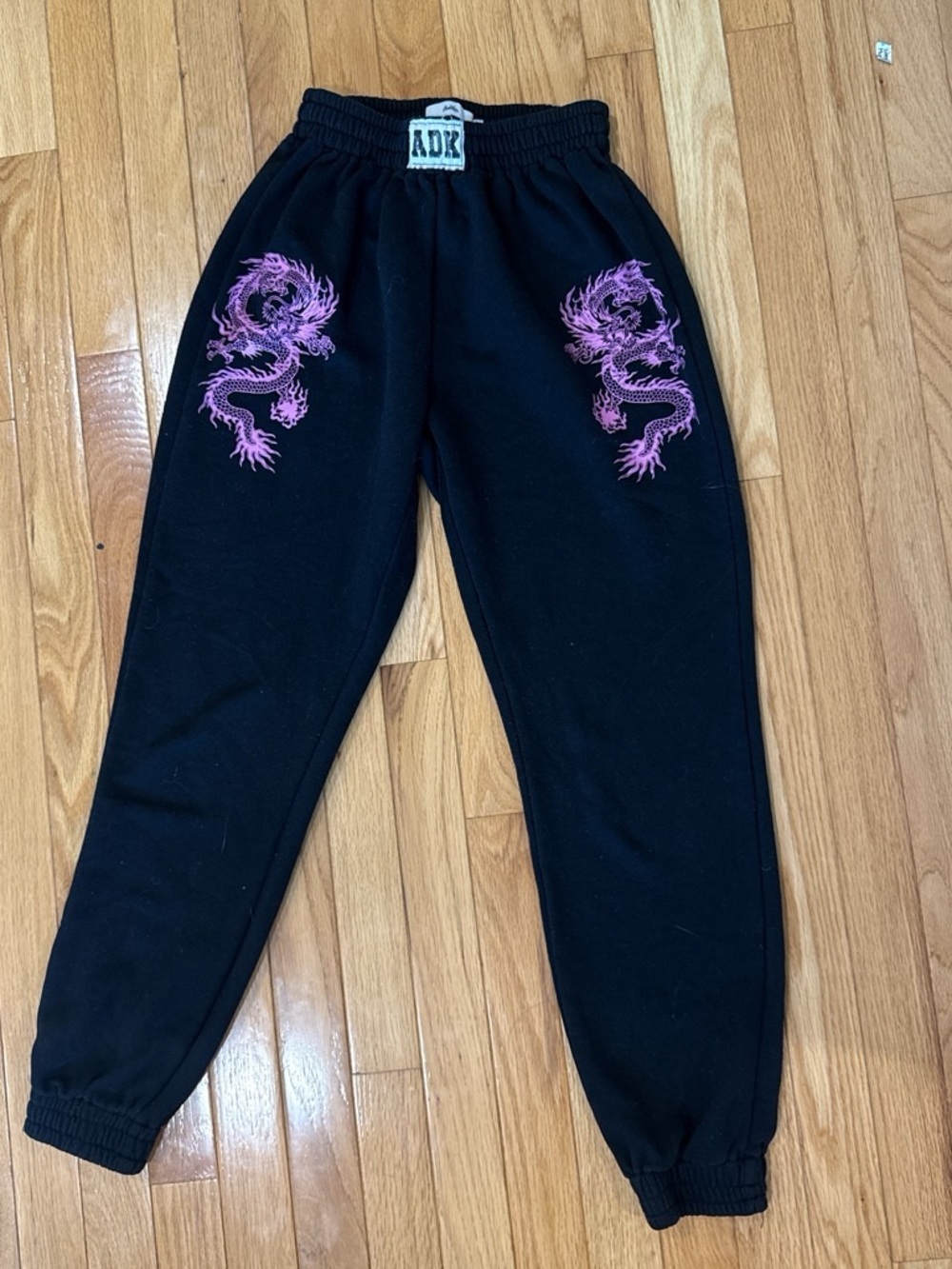 Adika Black Sweatpants with Pink Dragon Motifs